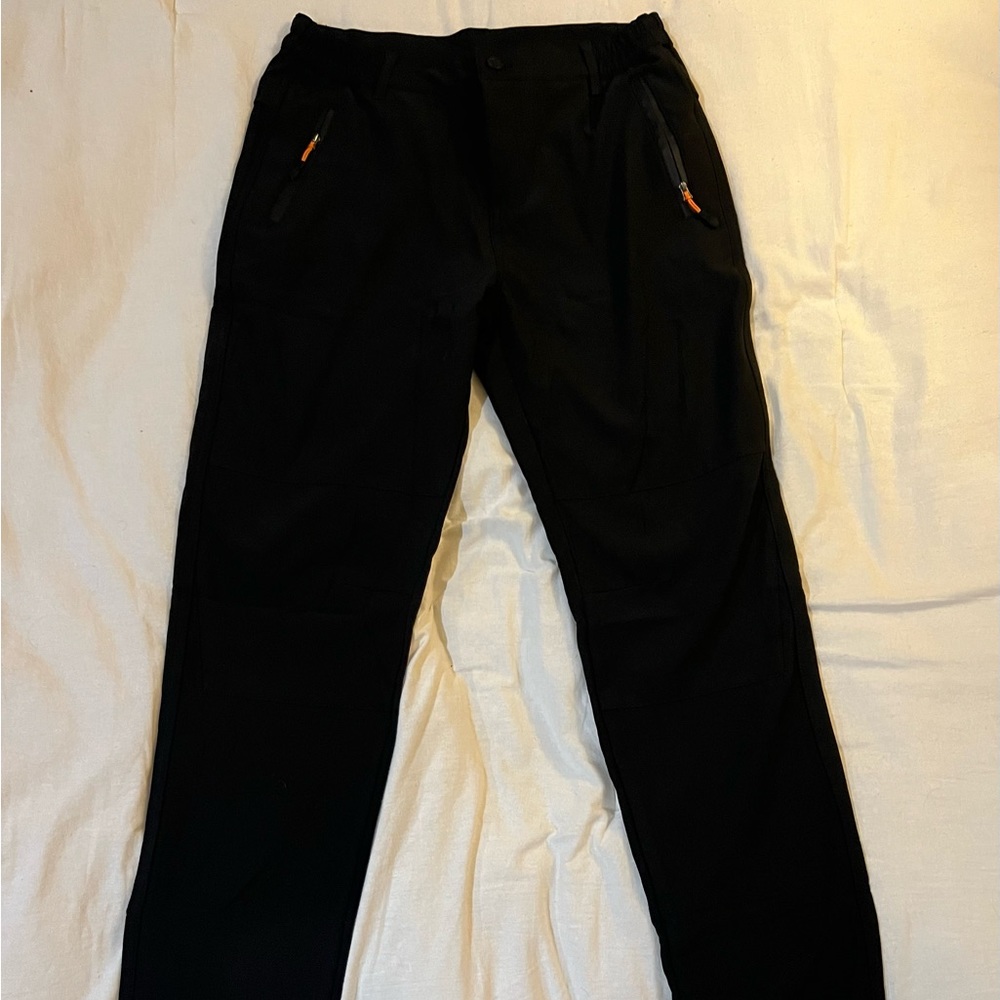Brand new ski/snow pants. Unisex. Size 32. Black